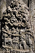 Candi Panataran - Main Temple. Back side of one of the giant guardian to left of the staircase of the temple with relief of tantri tale depicting small animals setting each other free.  